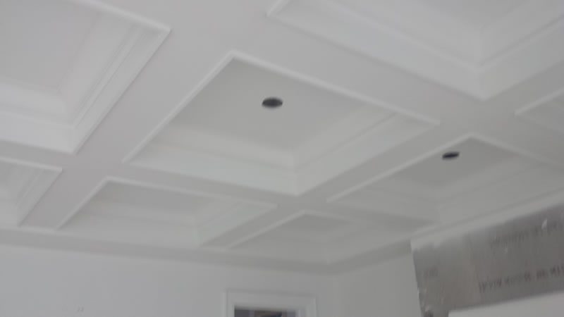 A coffered ceiling finished in white.