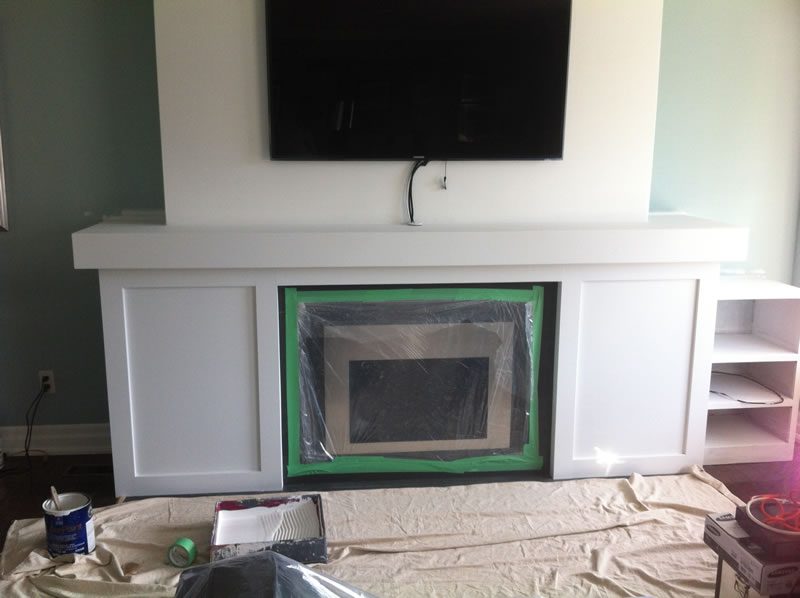 A fireplace surround masked and finished.