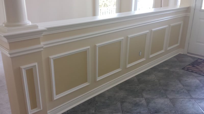 A panelled wall with wainscoting, painted by Superior Interiors.
