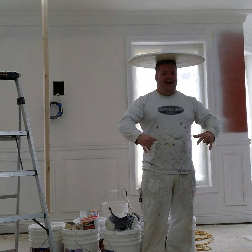 Wayne on site in his whites, in a room part-way through a job.